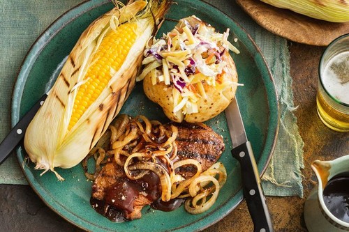 Barbecued steak and onion with jacket potatoes