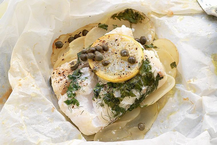 Baked fish with capers, potato and lemon