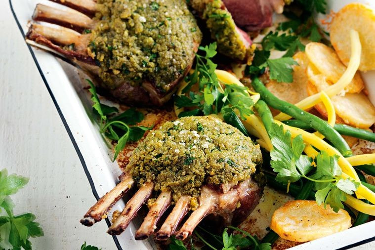 Pesto-crusted lamb racks with golden parmesan potatoes