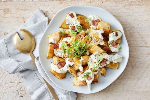 Warm potato salad with cheesy sauce