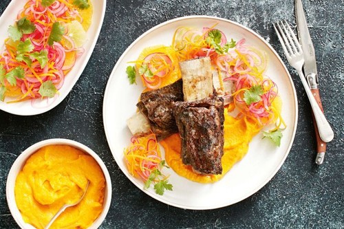 Beef ribs with carrot puree and citrus salad
