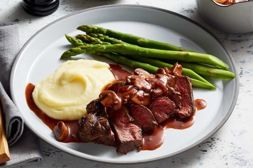Grilled steaks with caramelised onion and mushroom sauce