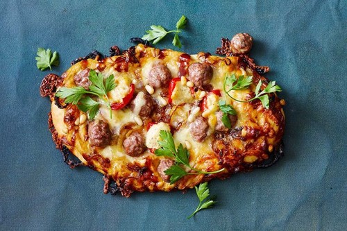 Sausage, caramelised onion and hummus pizzas